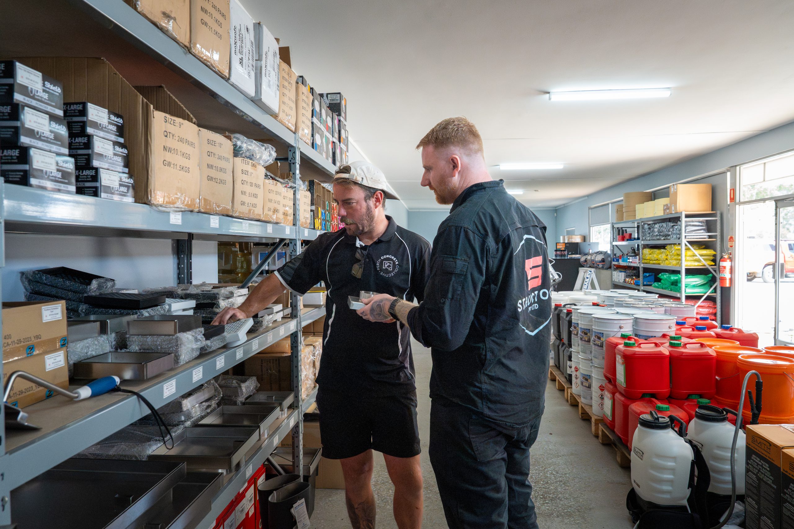 Sales staff assisting customers with browsing the shelves of Structool in Canning Vale